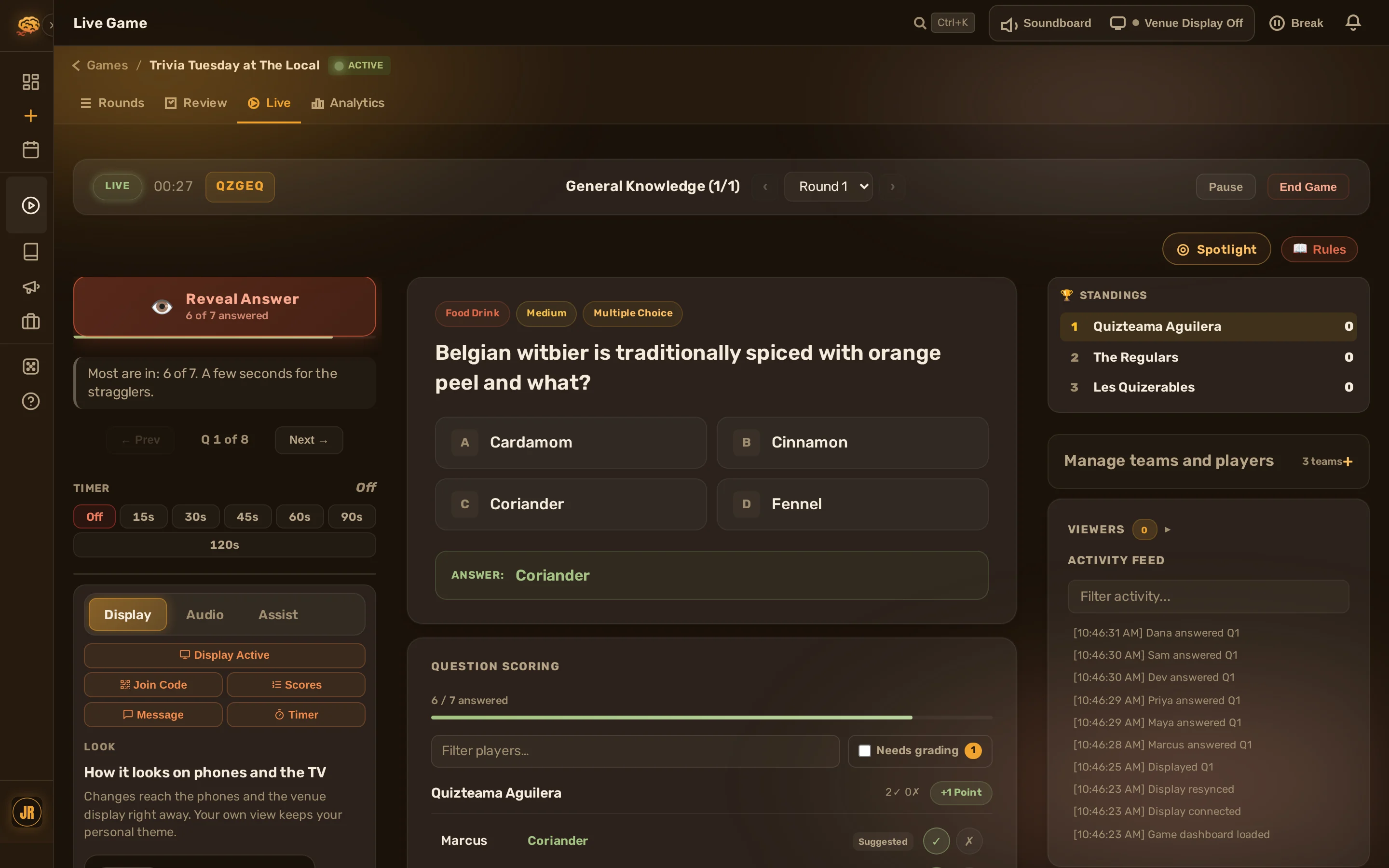 The live console mid-game: the reveal button with the answered count, question and answer key, standings, and the Display, Audio and Assist tabs